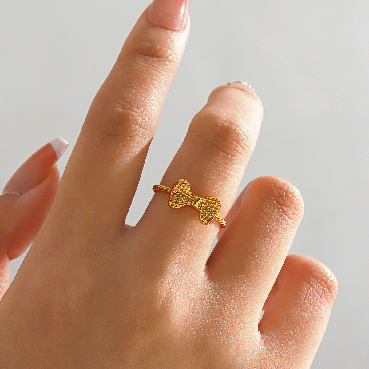 Textured bow ring ( stainless steel adjustable)